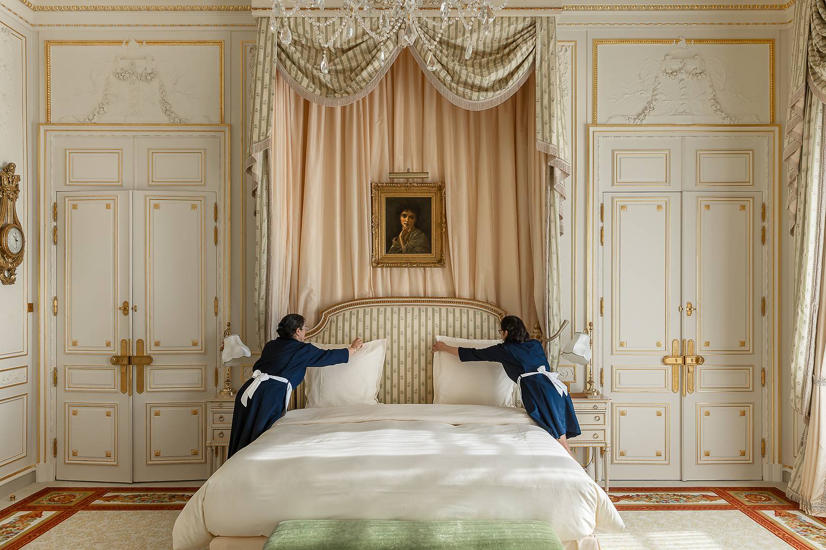 The sumptuous master bedroom in the Suite Vendôme, overlooking the iconic square.