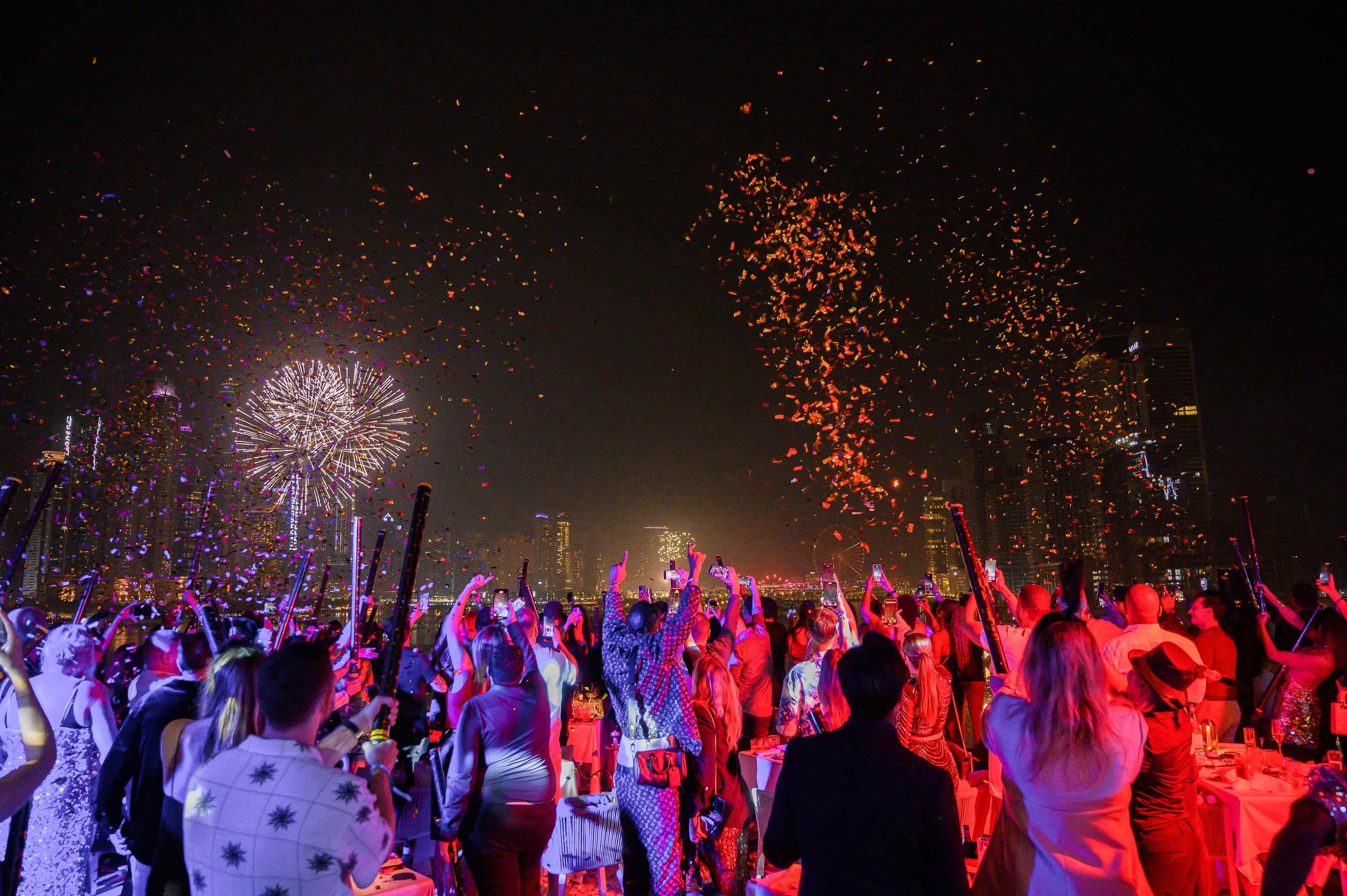 Guests celebrating the first moments of the new year with fireworks on the terrace at Maiden Shanghai's NYE edition party.