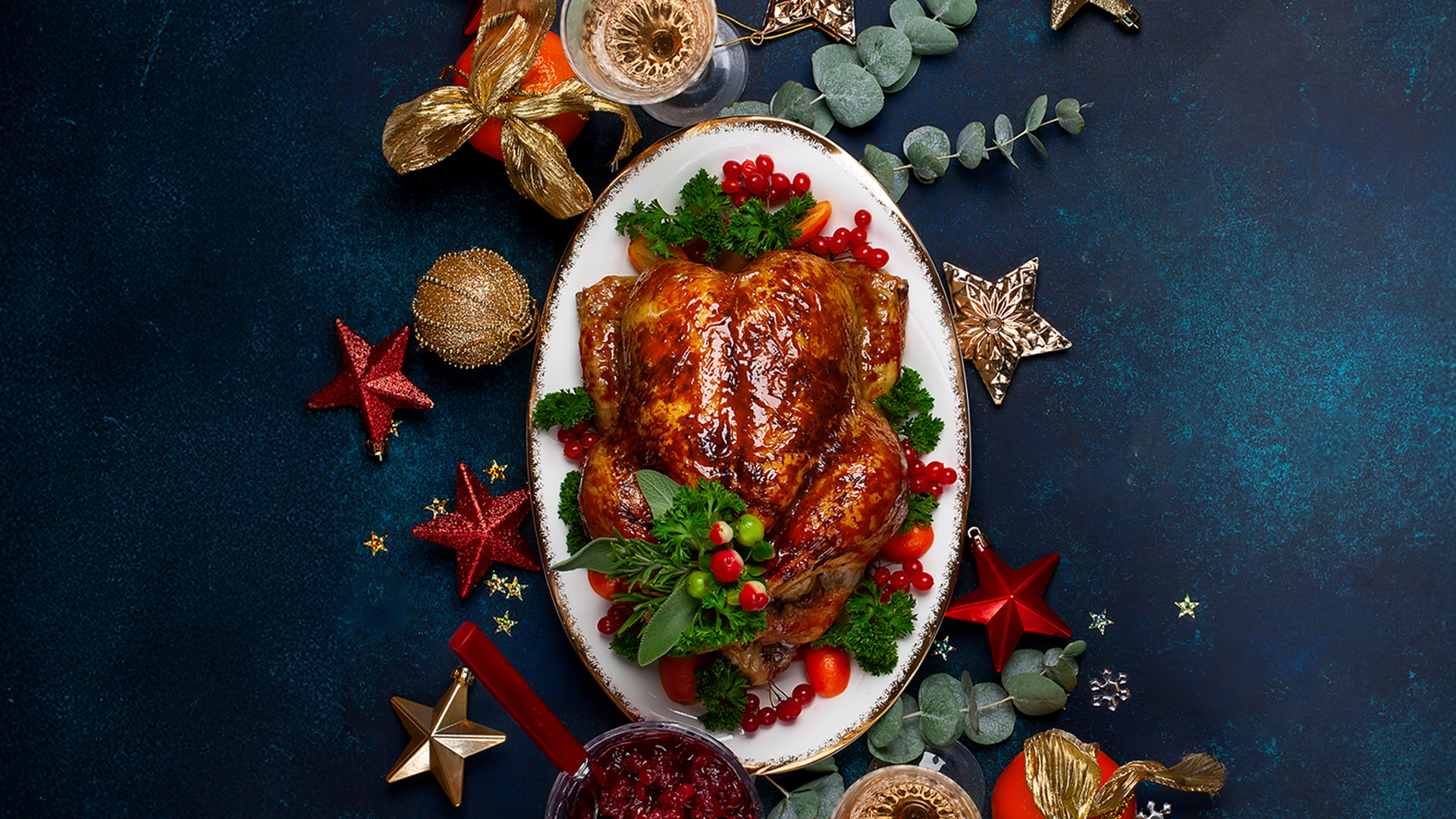 A beautifully roasted and garnished Christmas turkey plated at The Delisserie, part of FIVE Palm Jumeirah's festive takeaway feast.