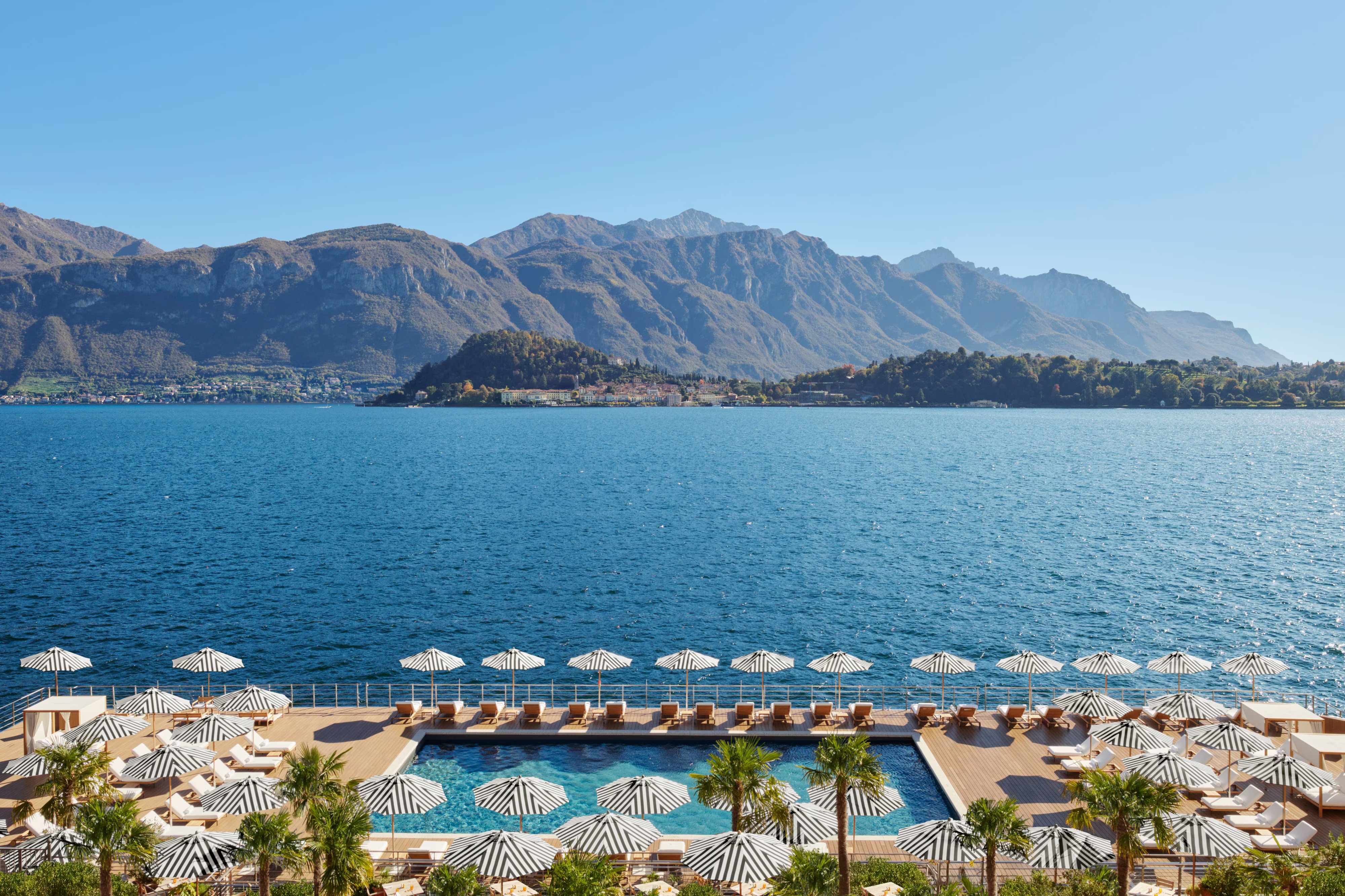 The stunning floating infinity pool at The Lake Como EDITION, situated directly on the waters of Lake Como with panoramic mountain views.