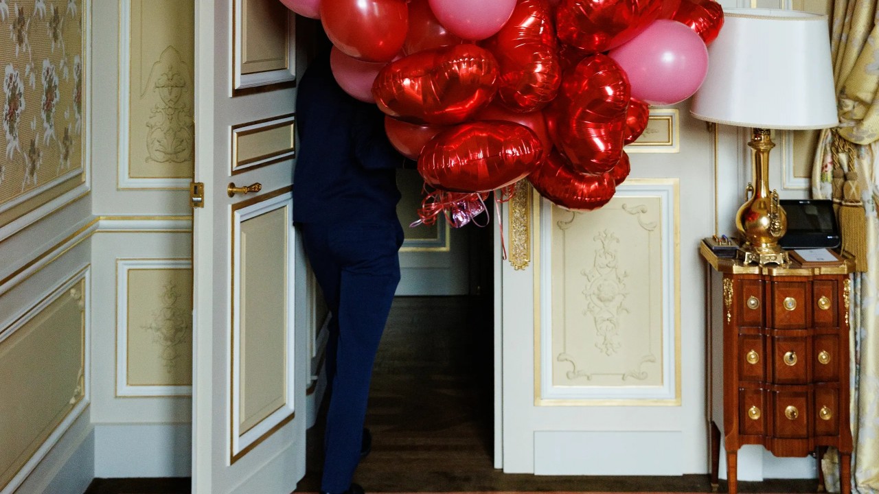 Ritz Paris Valentine's Day romantic suite surprise with heart balloons.